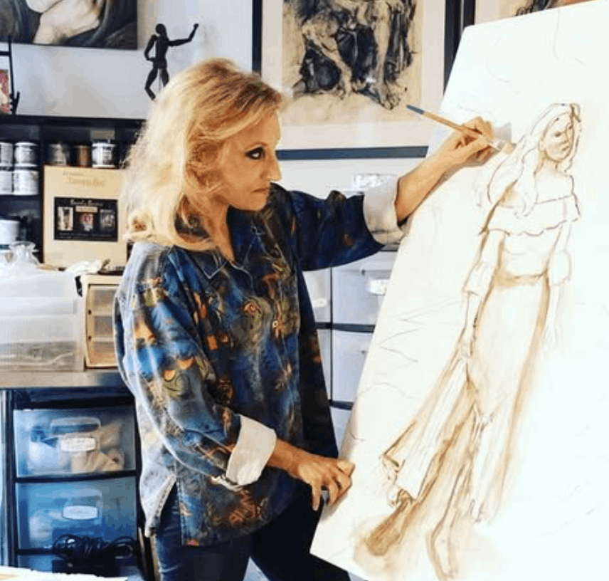Beverly Barris painting in her studio